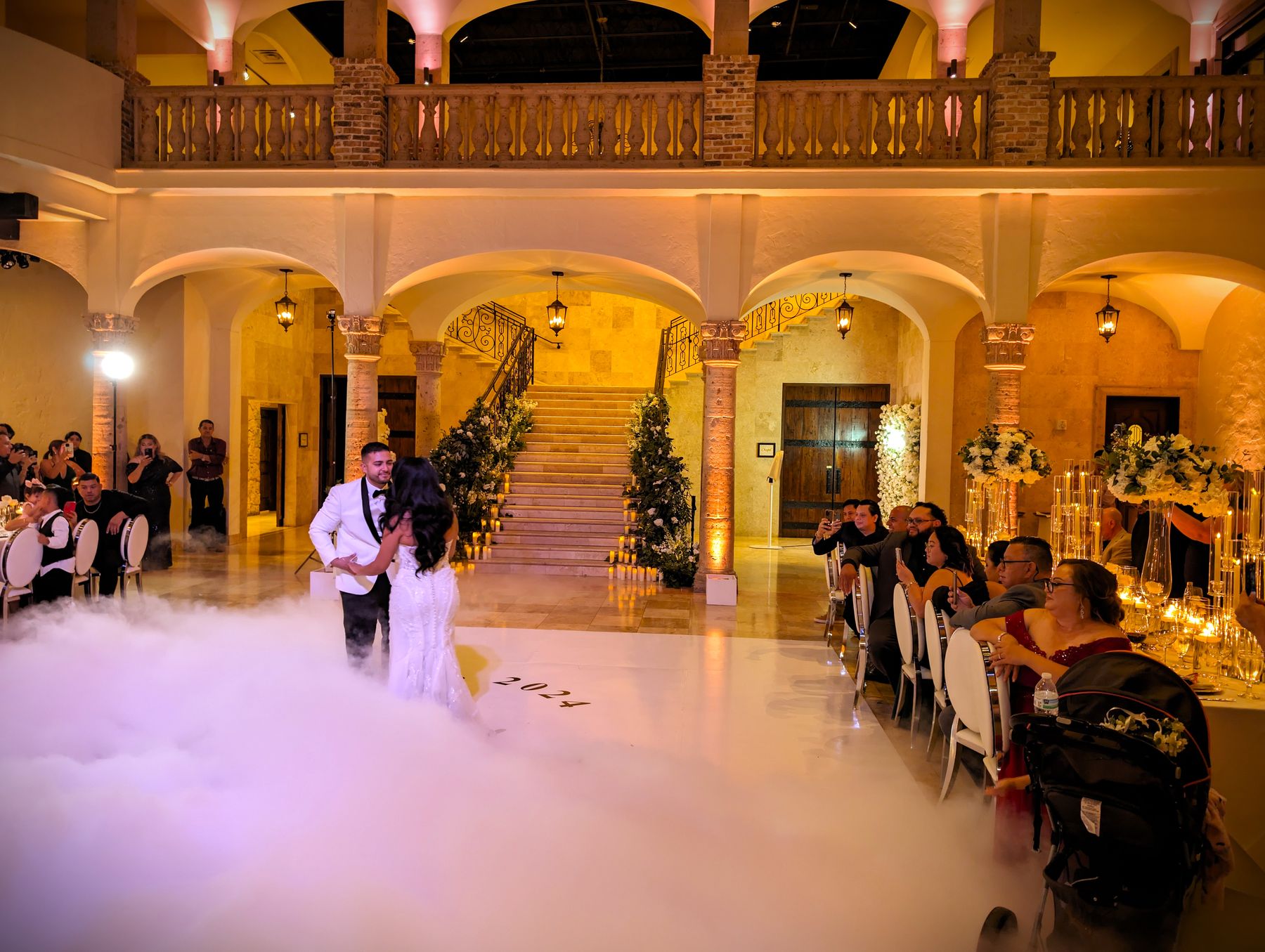 First dance on the clouds in a warmly lit ballroom